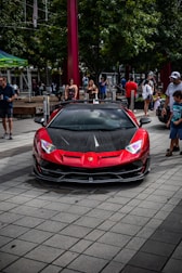 a red sports car parked on the side of the road