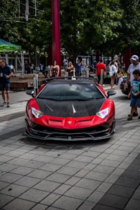 a red sports car parked on the side of the road