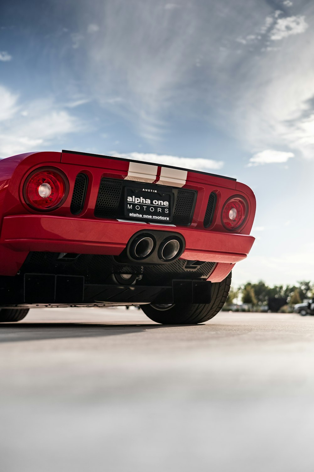 the rear end of a red sports car