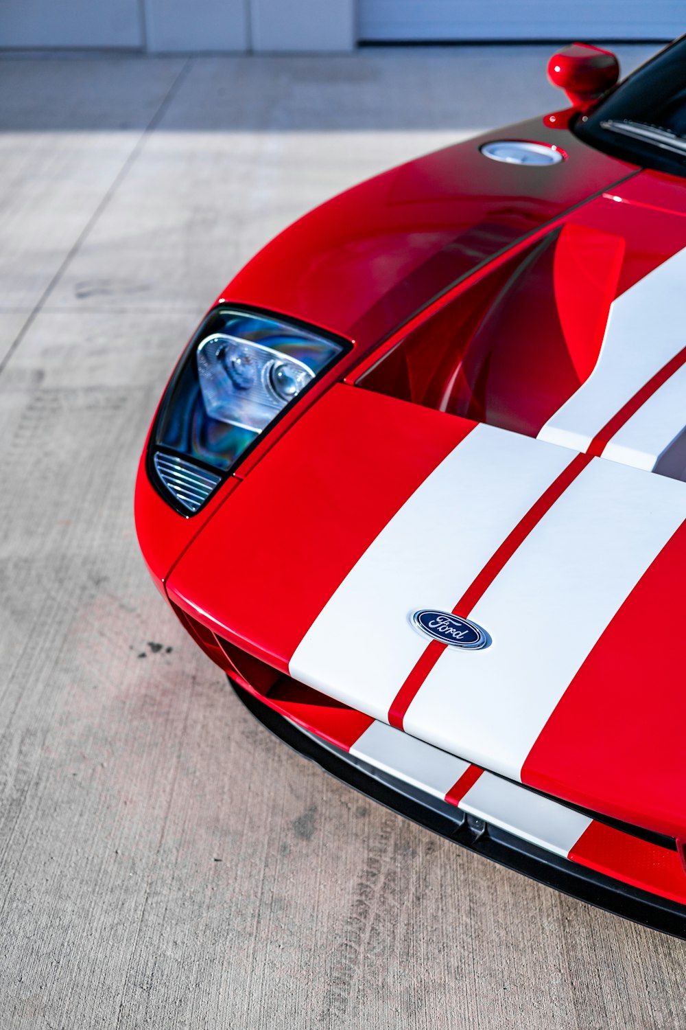 a close up of a red and white sports car