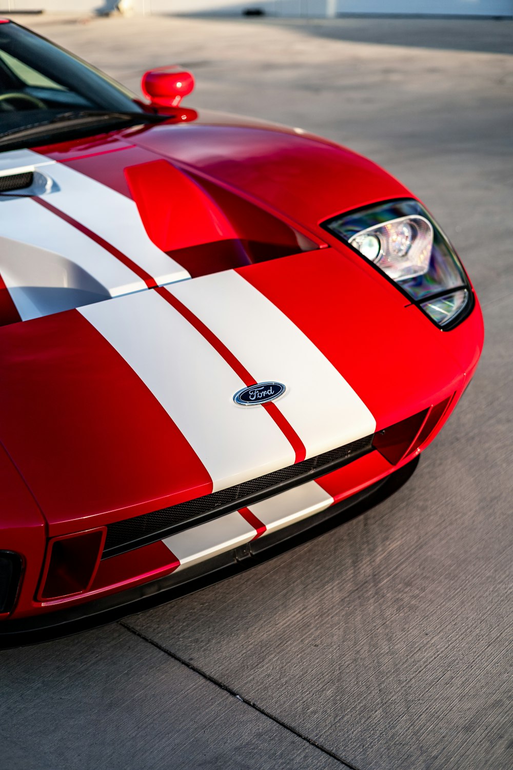 a close up of a red and white sports car