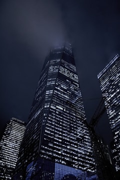 a very tall building lit up at night