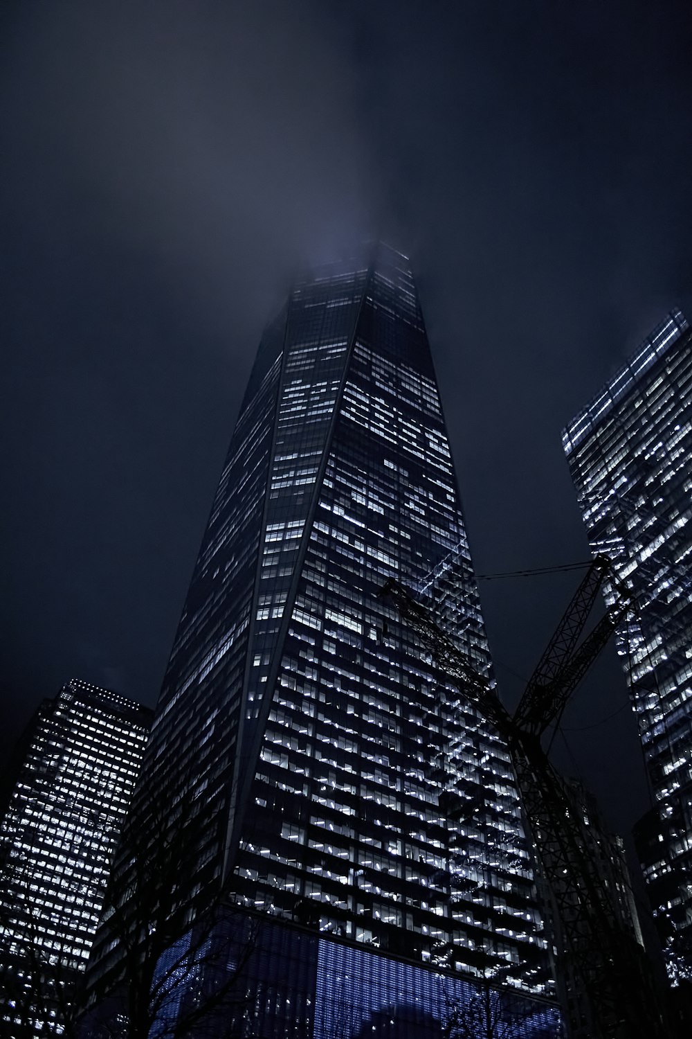 a very tall building lit up at night