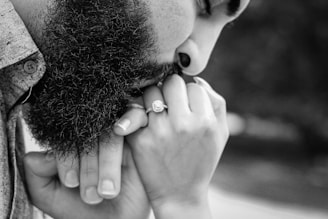 a black and white photo of a man with a beard
