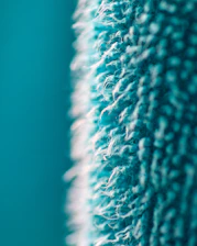 a close up of a blue and white rug