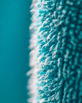 a close up of a blue and white rug