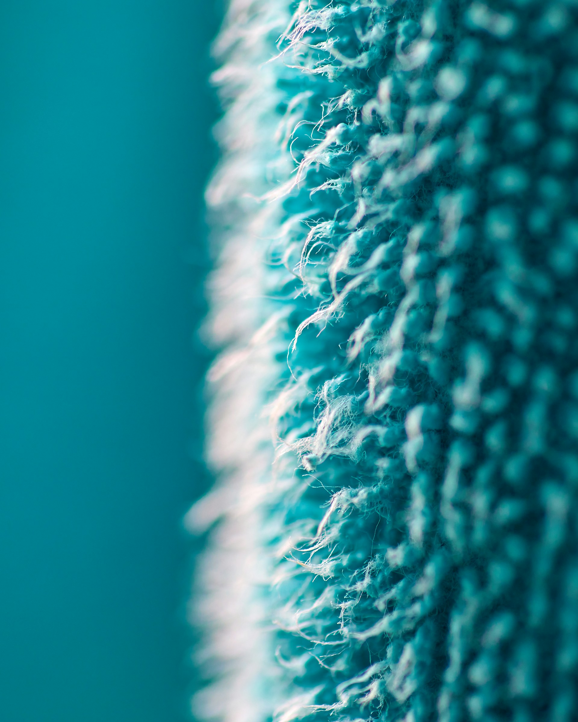 a close up of a blue and white rug