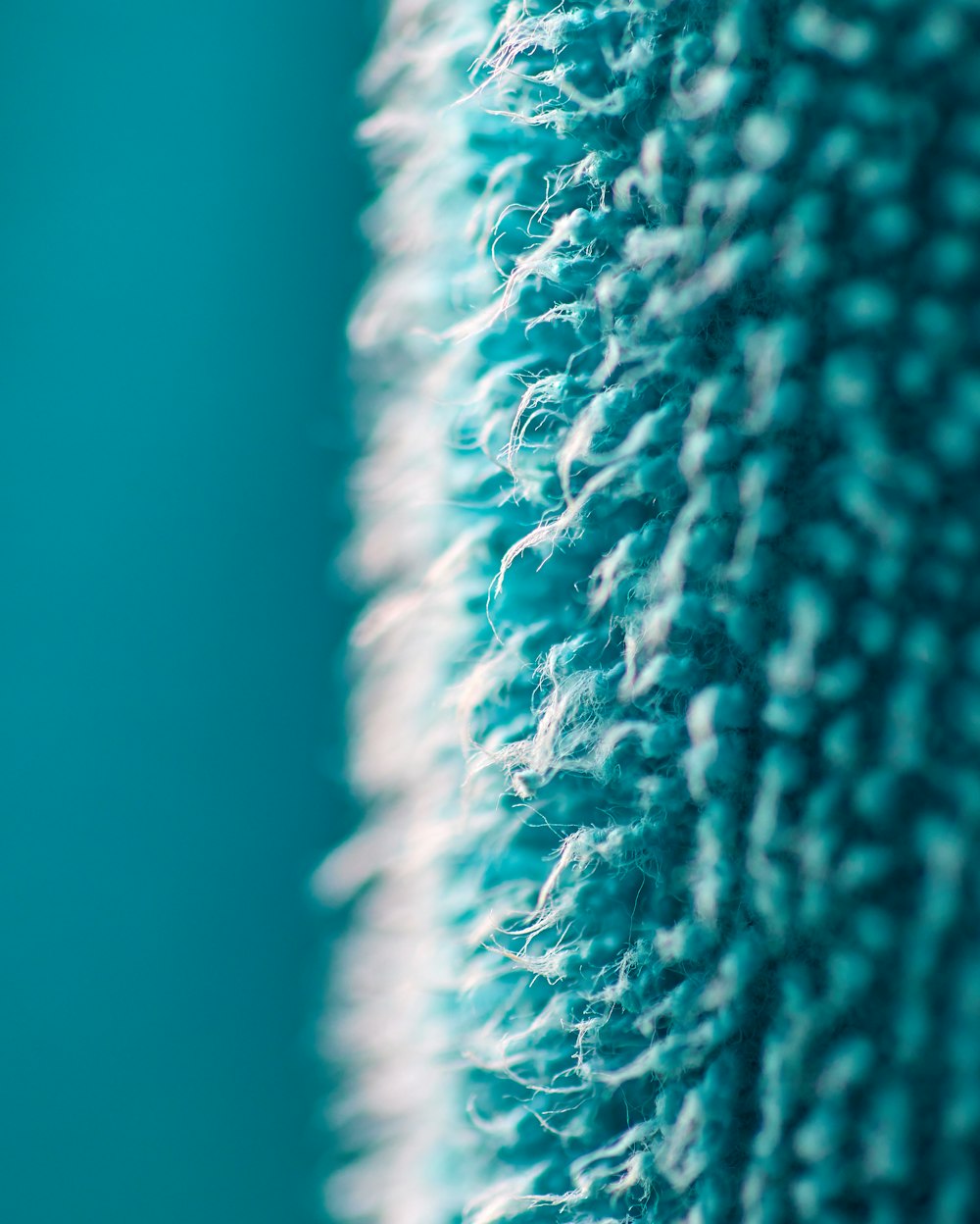 a close up of a blue and white rug