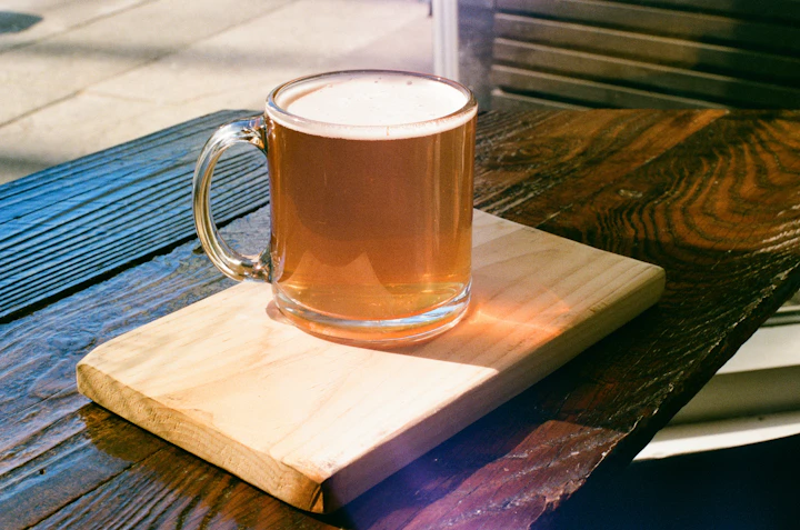 Amber Vienna-style lager in a pint glass on a wood table