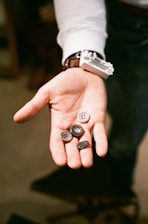 a person with two buttons in their hand