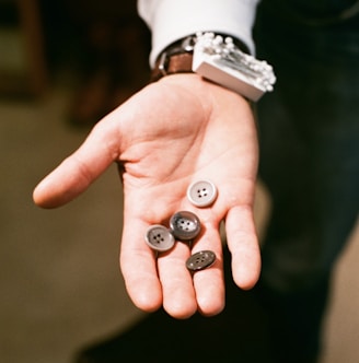 a person with two buttons in their hand