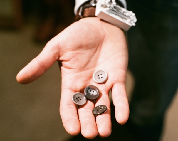 a person with two buttons in their hand