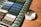 A close-up of premium fabric swatches on a wooden table.