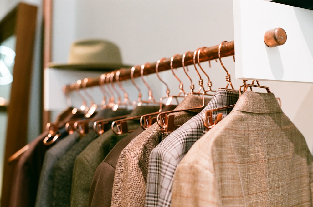 a rack of clothes hanging on a wall