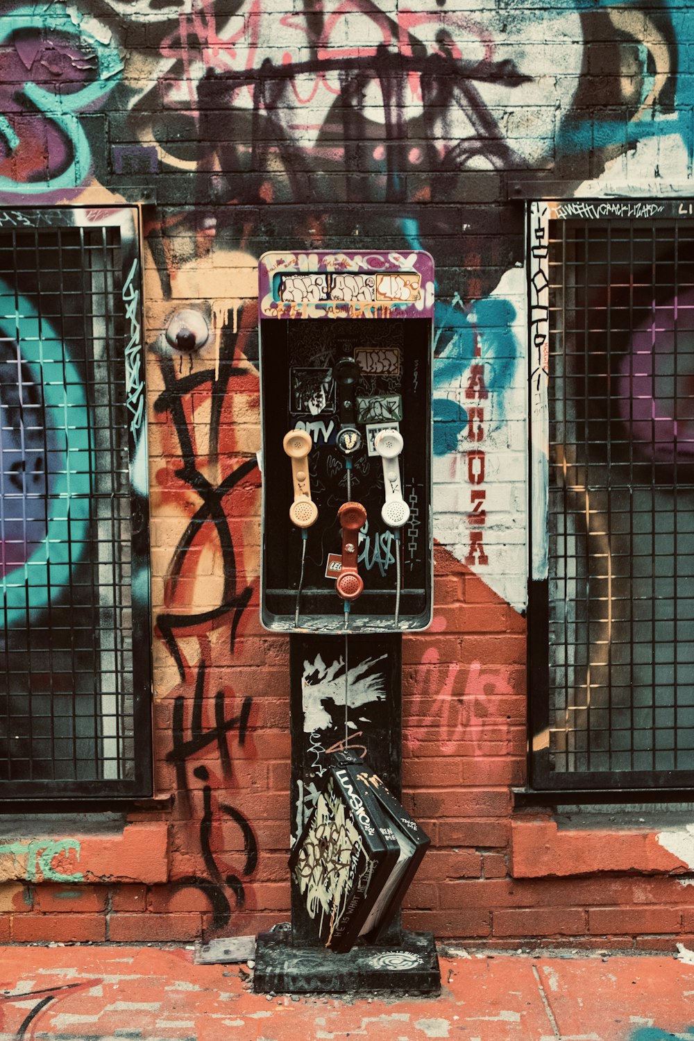 a street scene with focus on a wall with graffiti