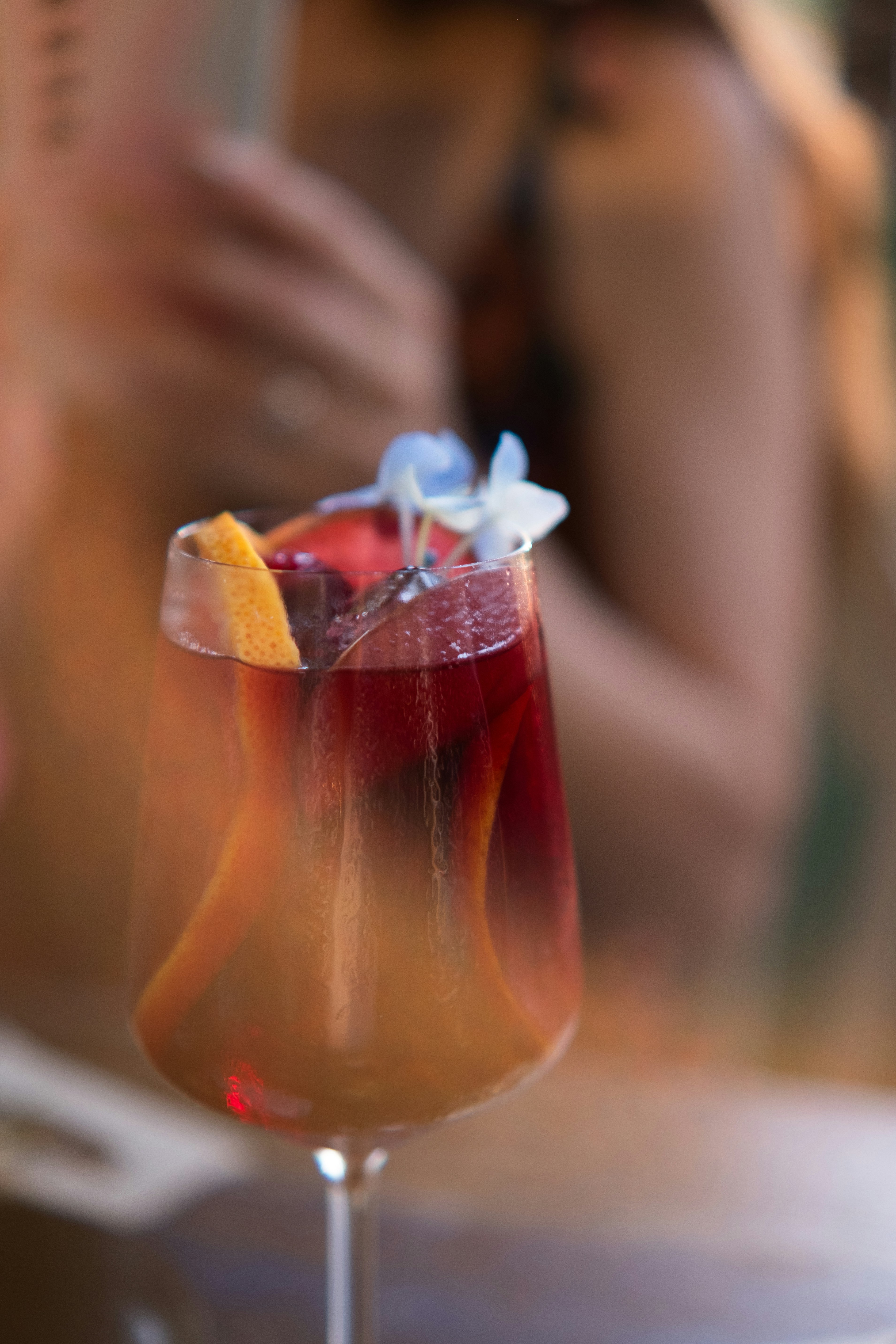 a close up of a wine glass with a drink in it