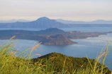 A panoramic view of the volcanic relief surrounding the island with lush greenery.