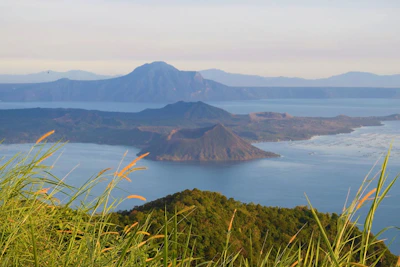 A panoramic view of the volcanic relief surrounding the island with lush greenery.