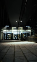 A sleek, modern lobby entrance of a luxury residence bathed in soft golden light