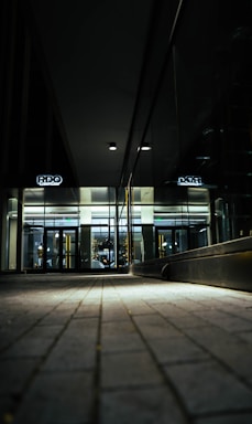 A sleek, modern lobby entrance of a luxury residence bathed in soft golden light