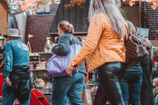 a group of people walking down a street