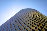a very tall building with a sky background