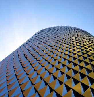 a very tall building with a sky background