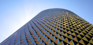 a very tall building with a sky background