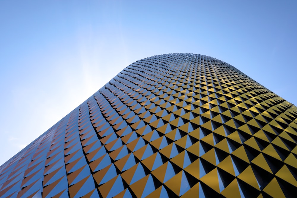 a very tall building with a sky background