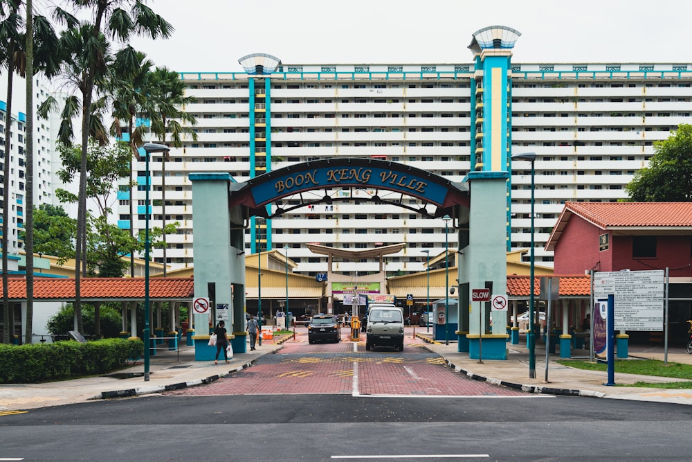 a large building with a blue and green entrance