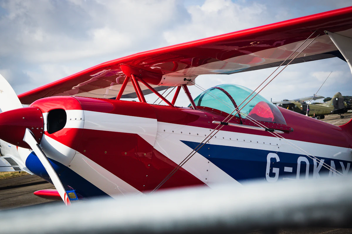 Close-up of a red, white and blue G-registered aerobatic biplane
