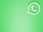 a green wall with a white phone on it