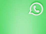 a green wall with a white phone on it
