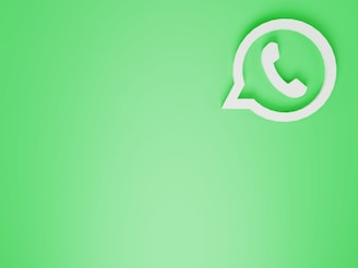 a green wall with a white phone on it