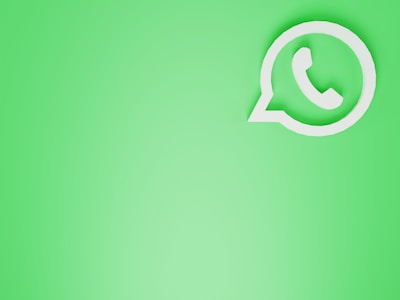 a green wall with a white phone on it
