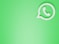 a green wall with a white phone on it