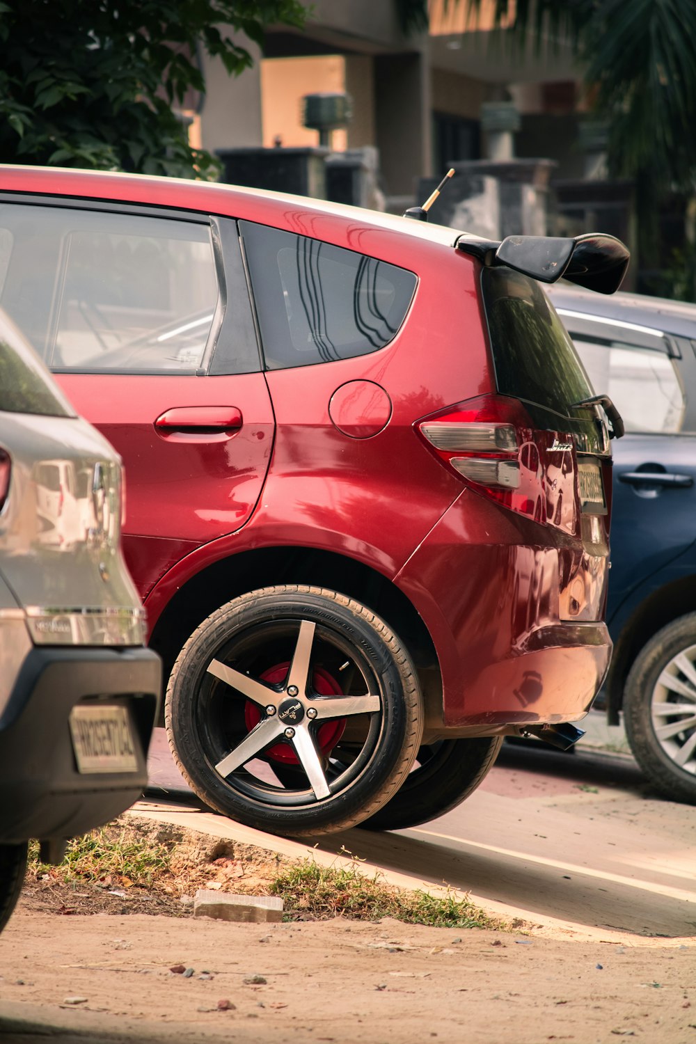 a red car parked on the side of the road