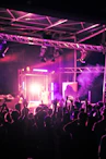 a group of people standing on top of a stage