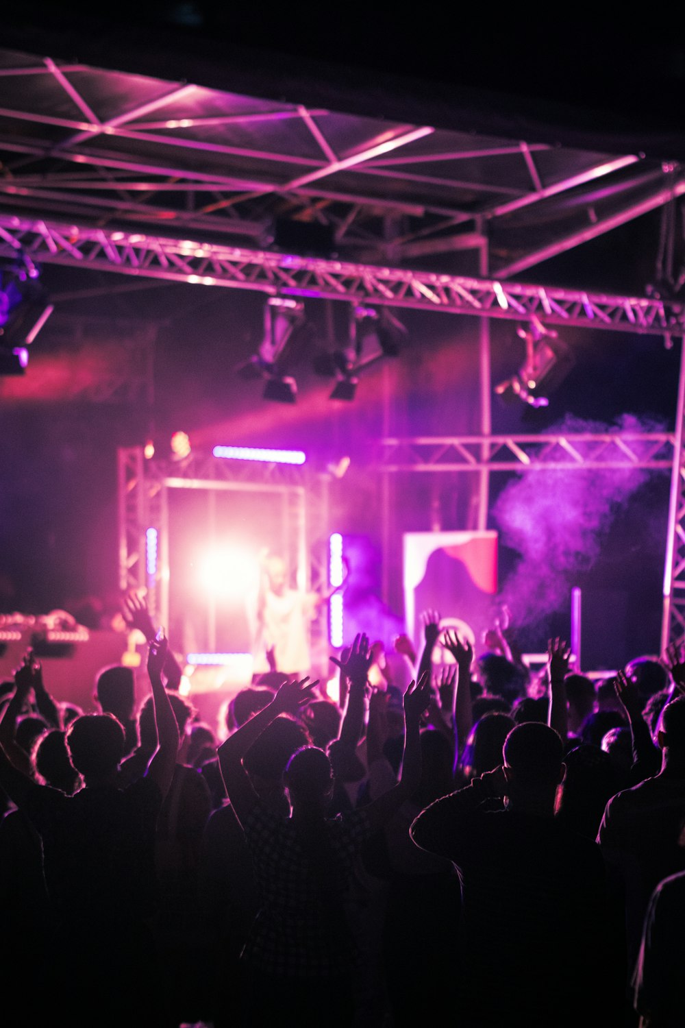 a group of people standing on top of a stage