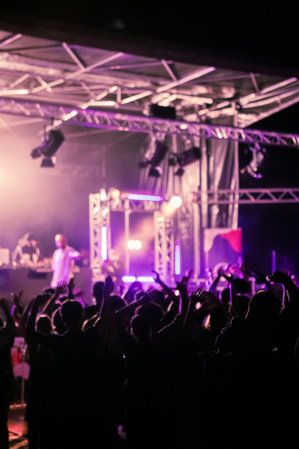 a group of people standing on top of a stage