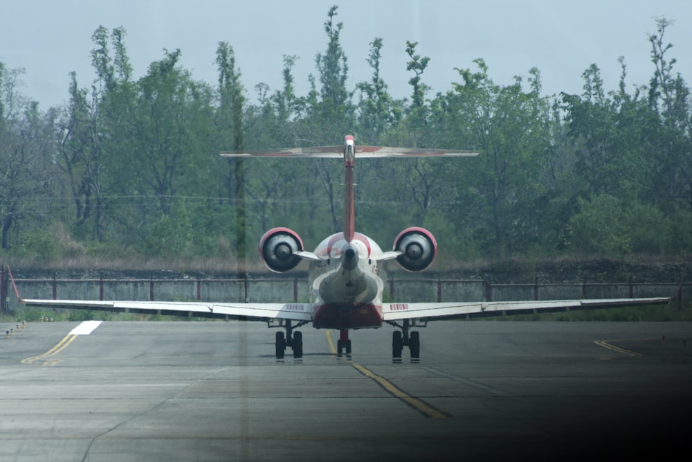 a small airplane sitting on top of an airport tarmac