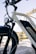A close-up of a well-maintained e-bike parked with delivery gear nearby.