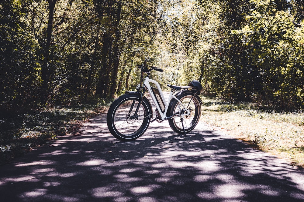 a bicycle parked on the side of a road