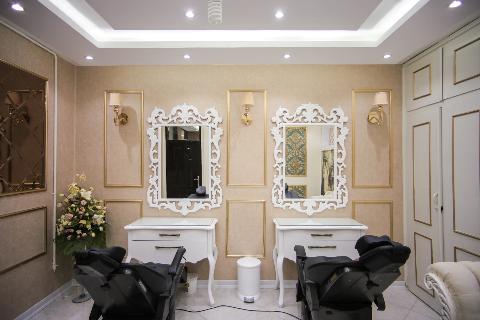 Twin styling chairs facing a mirror at MIRROR