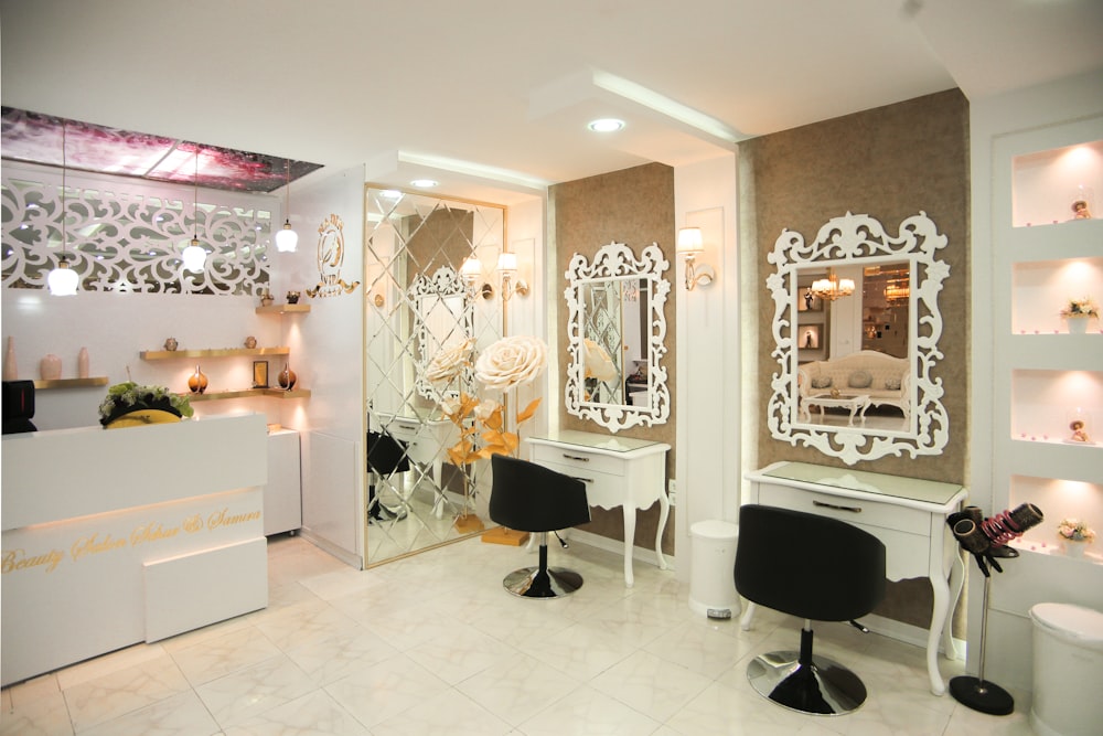 a salon with a mirror, chairs, and lights