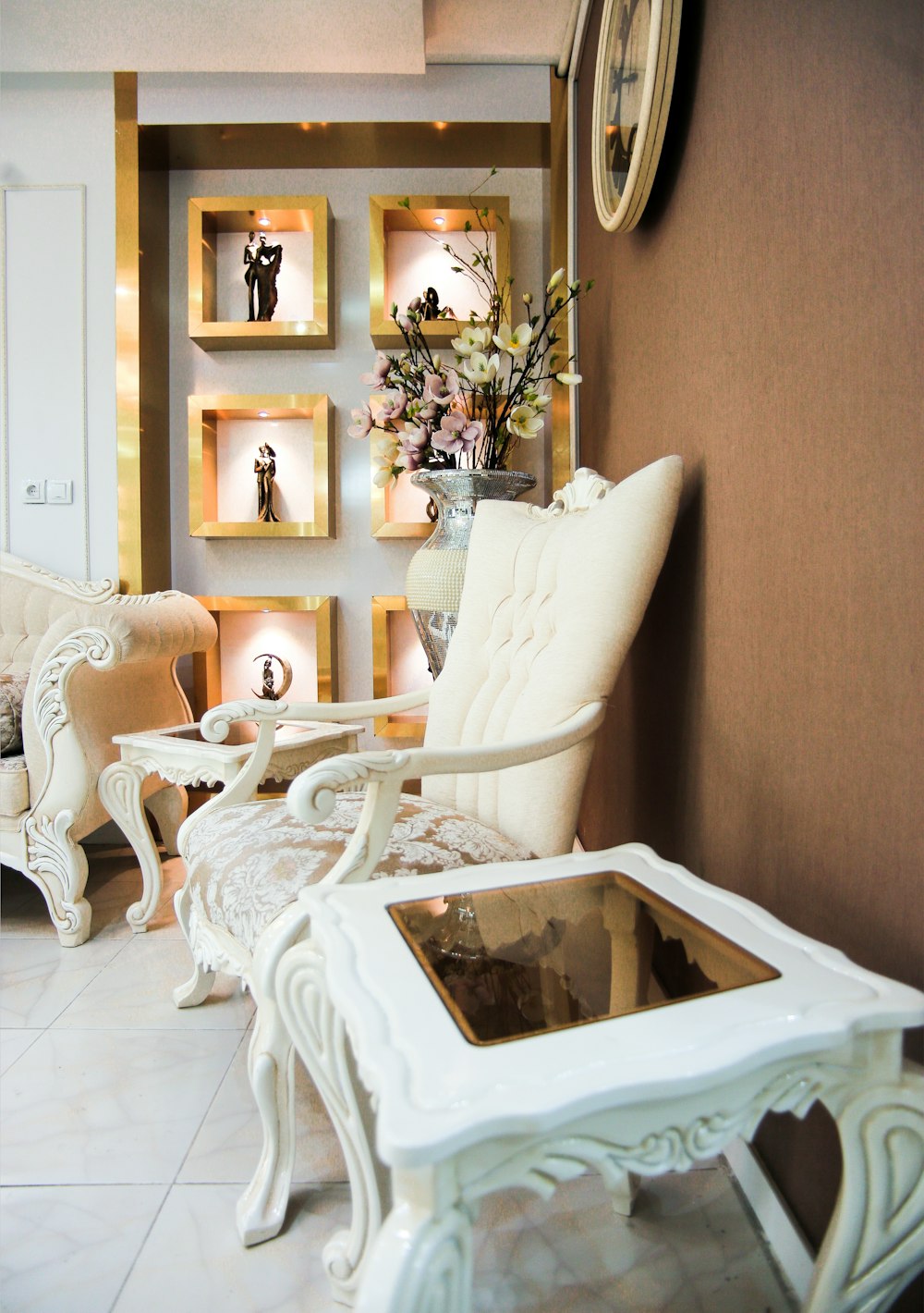 a living room filled with furniture and a clock on the wall