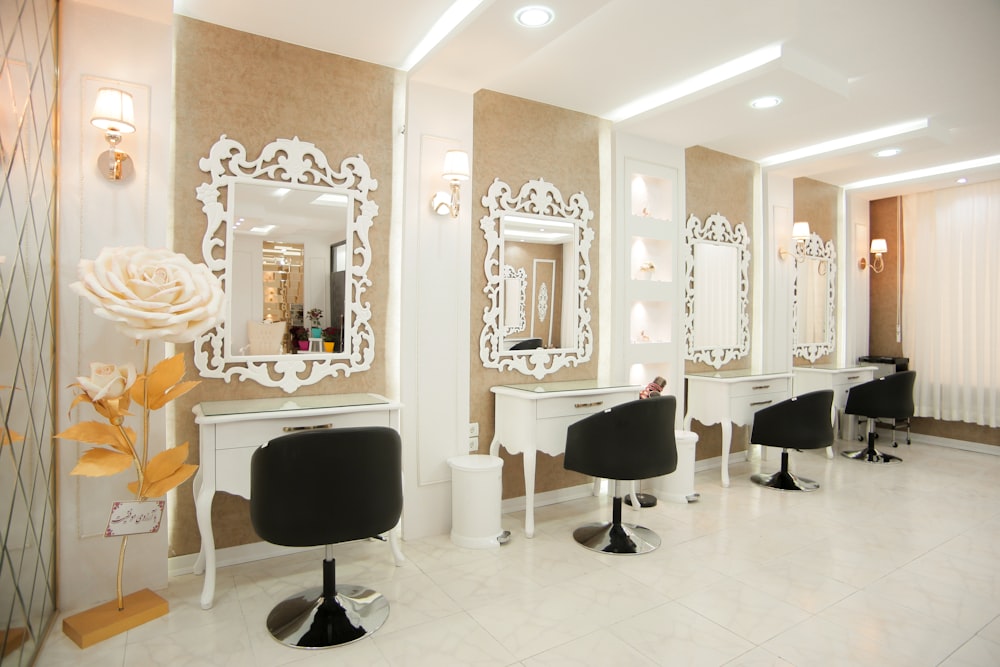 a hair salon with chairs and mirrors