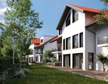 a row of white houses with a red roof