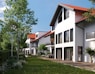 a row of white houses with a red roof