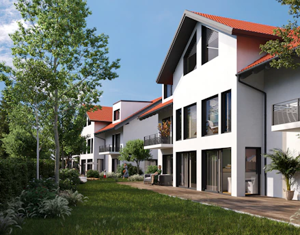 a row of white houses with a red roof